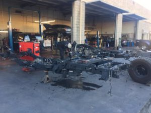 A vehicle being totally disassembled and being serviced